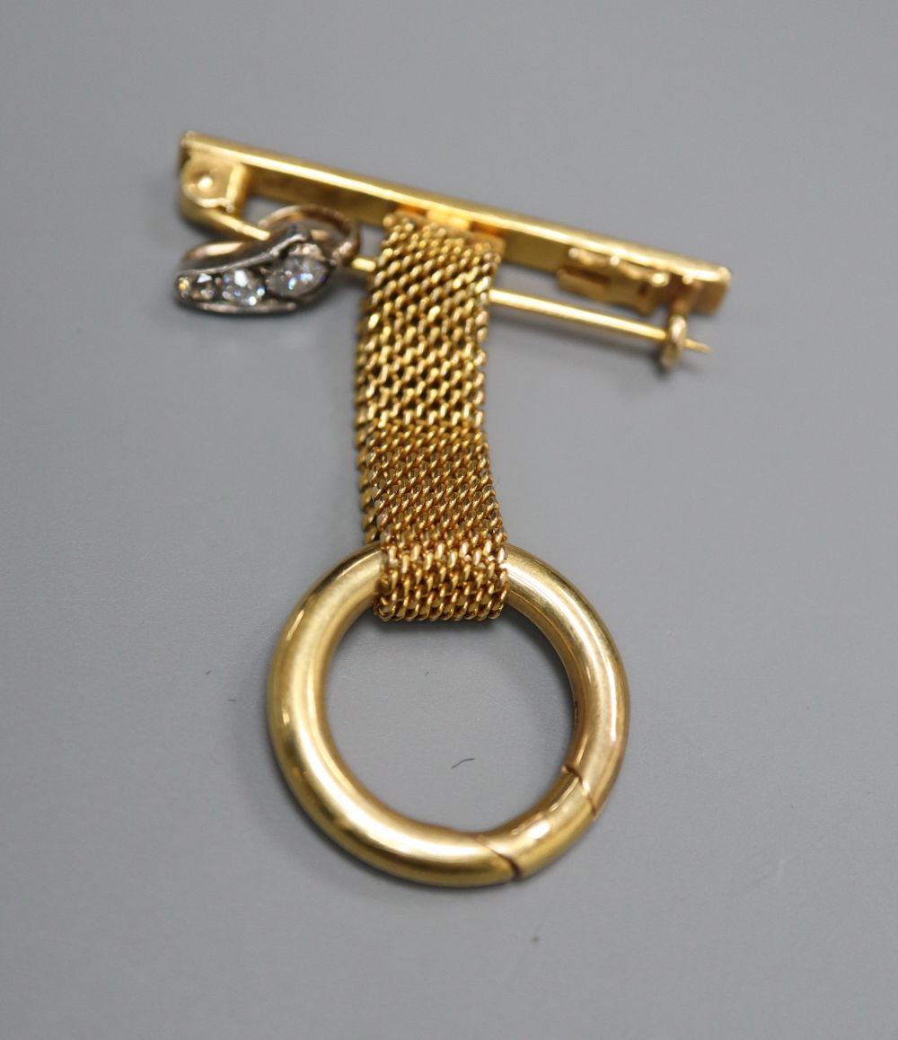 A 9ct gold lapel watch suspension and a three-stone graduated diamond set suspension, gross 7 grams.